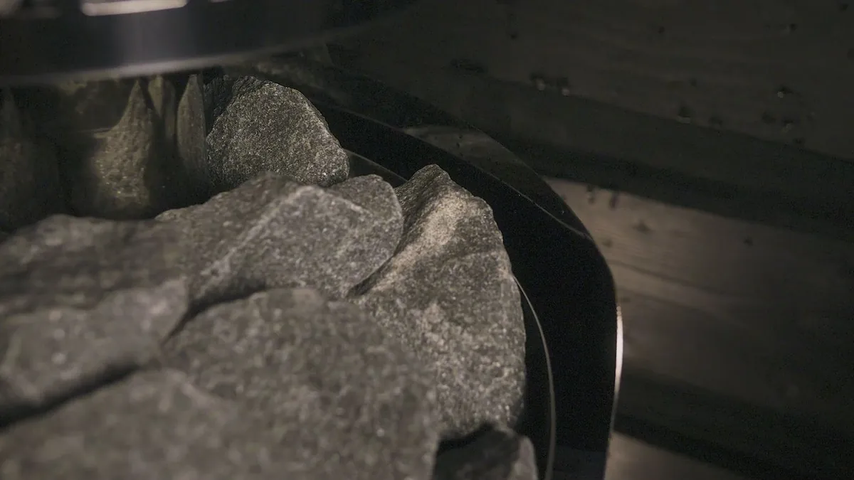 Sauna stones resting on a HARVIA heater